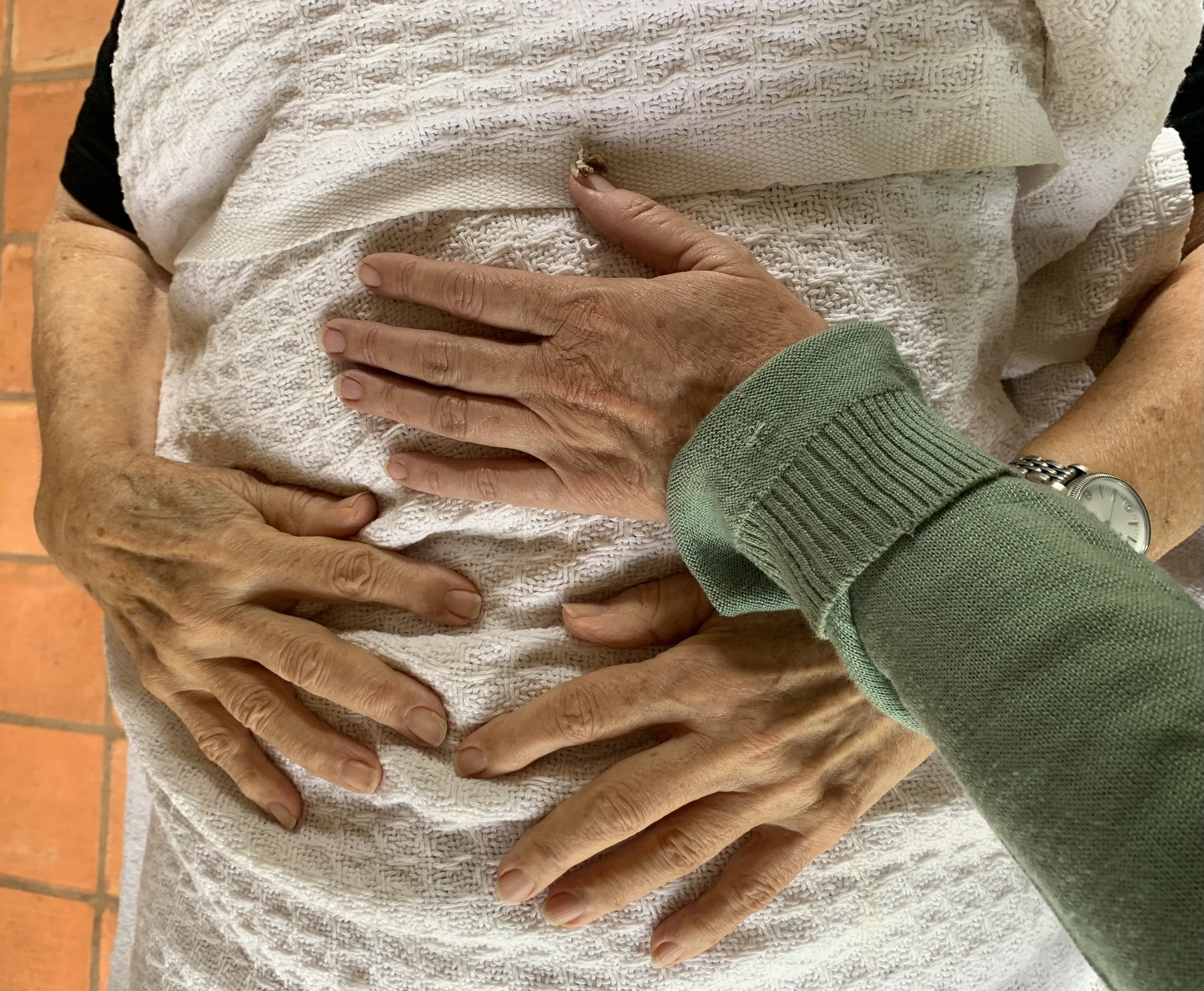 Close-up of Julia's hands during a CFT session
