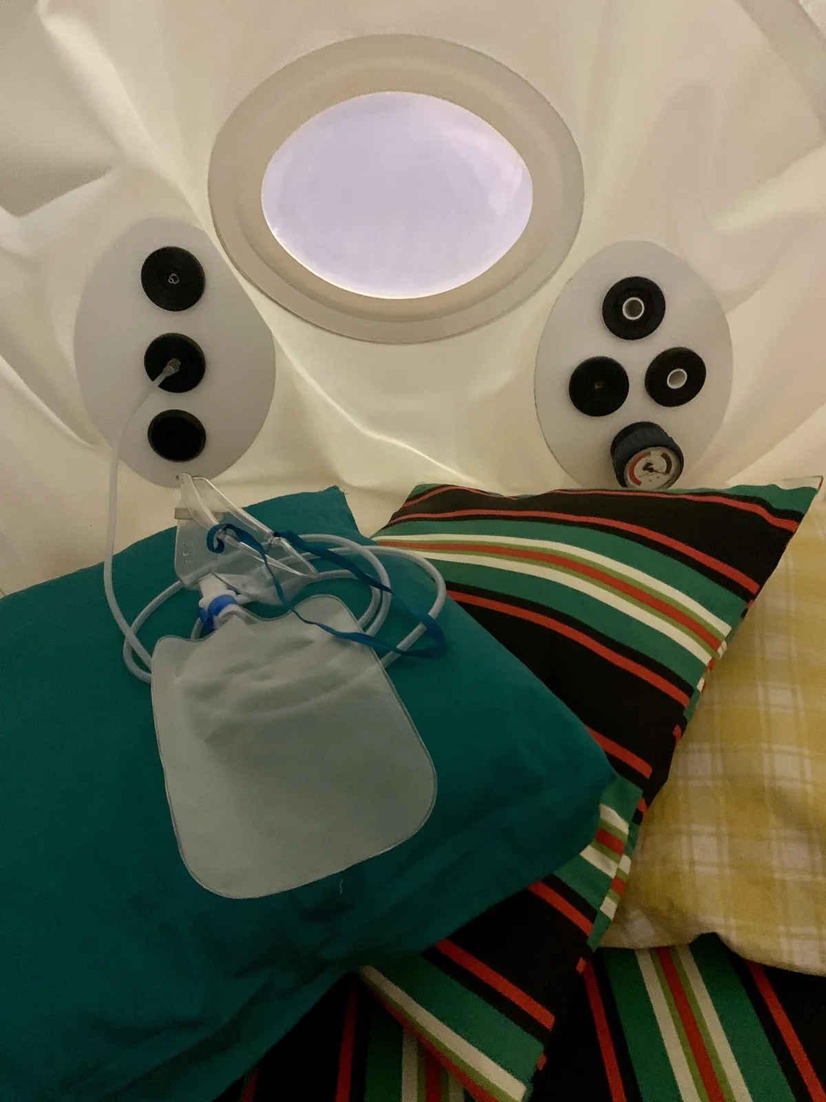 Mild HBoT chamber prepared with pillows and an oxygen mask