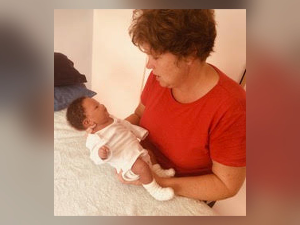 Julia holding and supporting a baby during a CFT session
